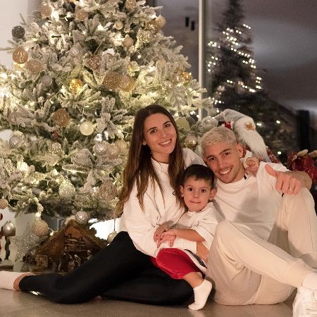Mina Bonino took a picture with her baby daddy and her son in her home.